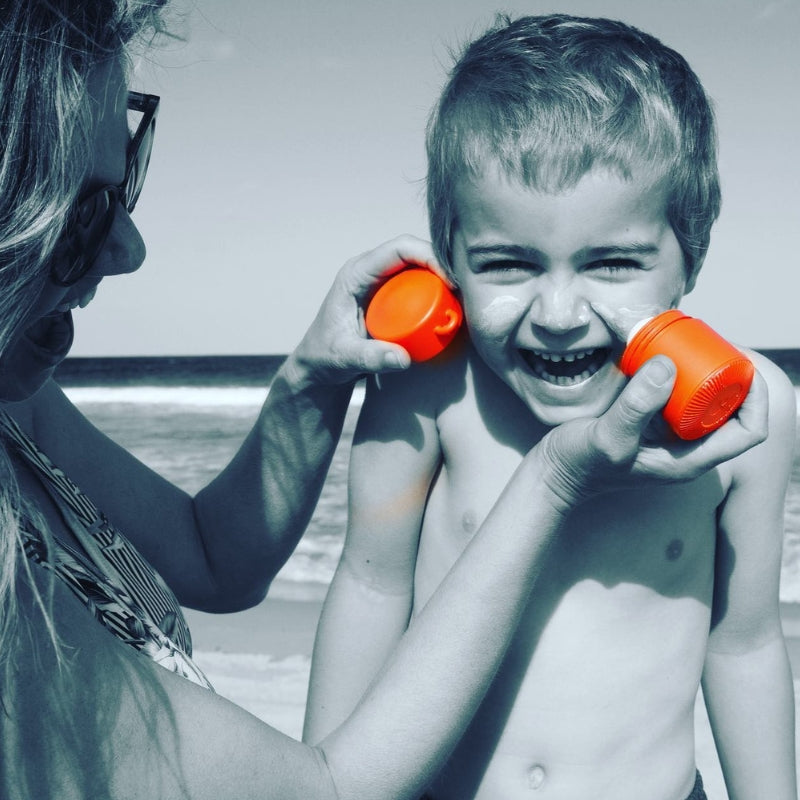 Solmates refillale sunscreen applicator - being put on a child 