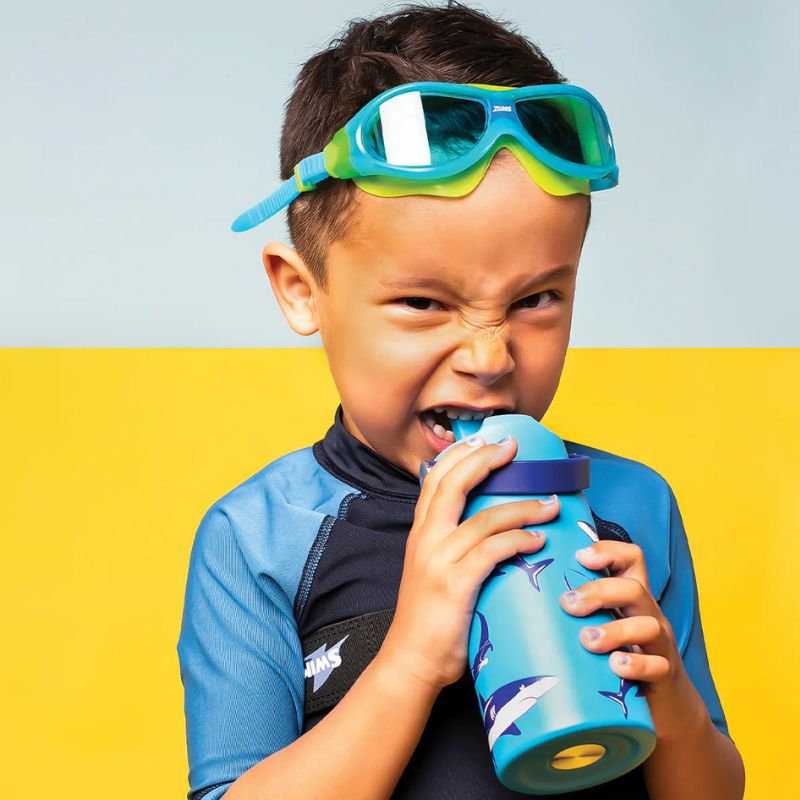 Cheeki Little Adventure Range - 400ml insulated stainless steel water bottle for kids - boy drinking from bottle.