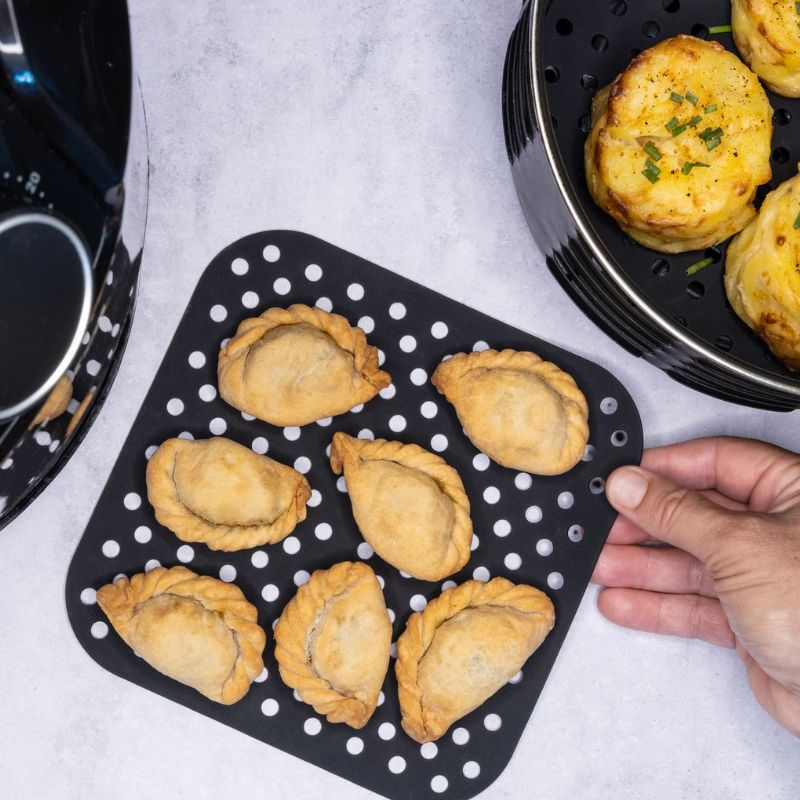 Cuisena Air Fryer Square silicone mats - black and grey - 18.5cm - set of 2 - shown with food.