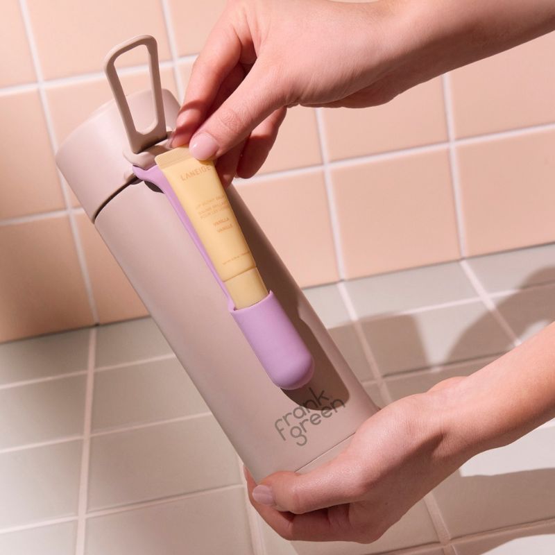 Frank Green lip gloss holder - shown attached to a bottle.