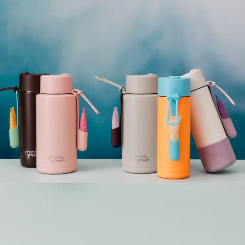 Frank Green lip gloss holders shown on bottles.