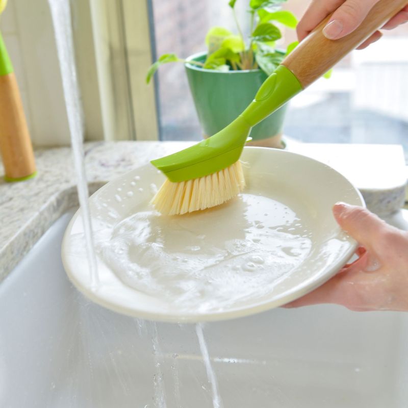 Full Circle Suds Up Dish Brush - green - in use.