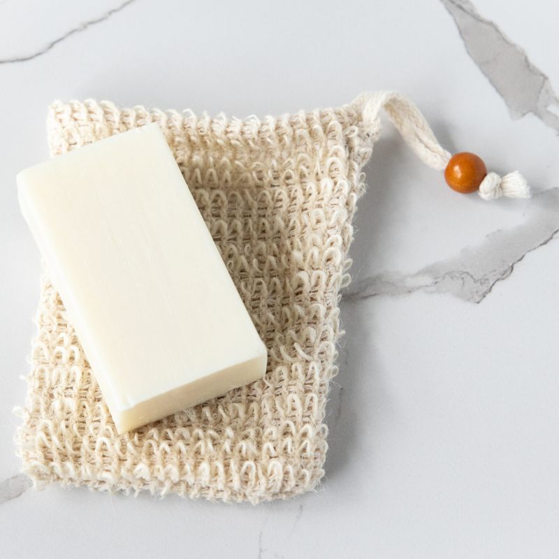 Green Essentials Sisal soap pouch saver - with a piece of soap on top. 