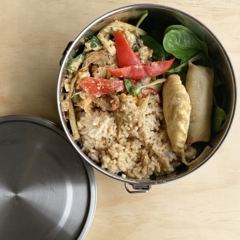 Green Essentials round extra large leakproof stainless steel container - shown with food. 