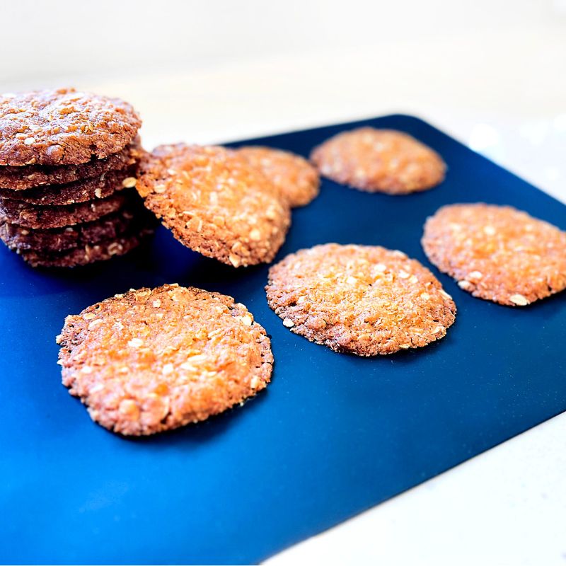 Green Essentials reusable silicone baking mat - with baked cookies on. 
