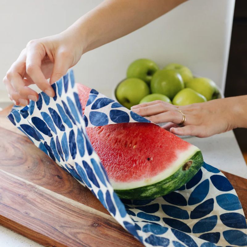 Honeybee Wraps - beeswax wraps - watermelon being wrapped. 