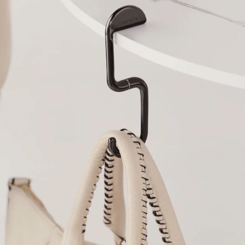 Klipsta FLIP Bag Hook - Chrome Black design holding a bag.