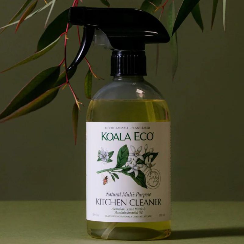 Koala Eco kitchen cleaner - 500ml bottle with pump - with lemon myrtle leaves in back ground. 
