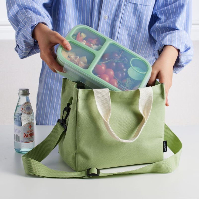 LocknLock - Lock and Lock - Mini insulated lunch bag with a strap. Showing woman putting a lunch box in the bag. 