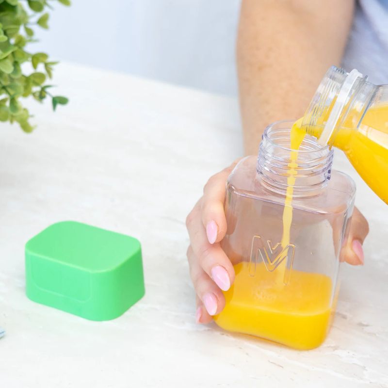 MontiiCo Bento Bottle - juice being poured in the bottle. 