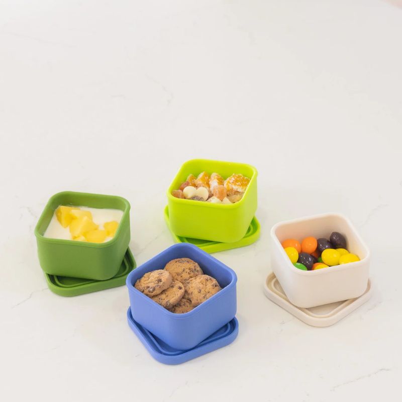 MontiiCo silicone snack tub - 4 tubs open with food in. 