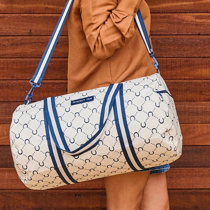 Project Ten Barrel Bag - Navy Horseshoe bag over the shoulder.