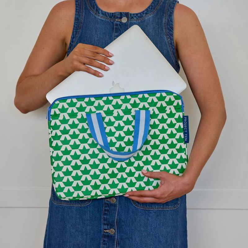 Project Ten Laptop case - woman holding bag putting laptop in.