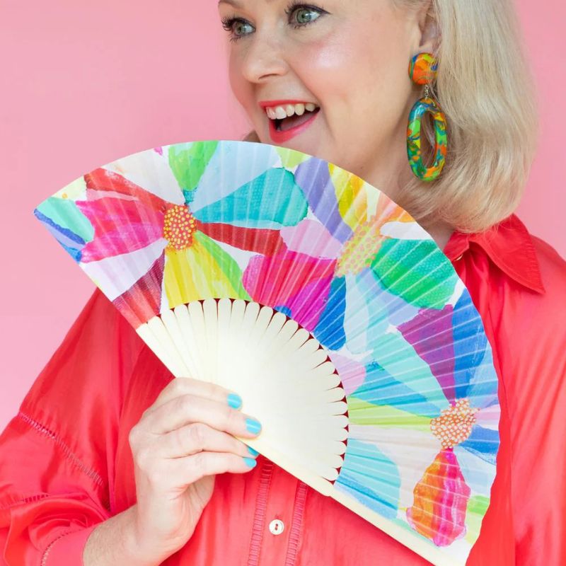 Ruby Olive RO x Lordy Dordie - Petal Party - handheld foldable fan - being held by a woman.