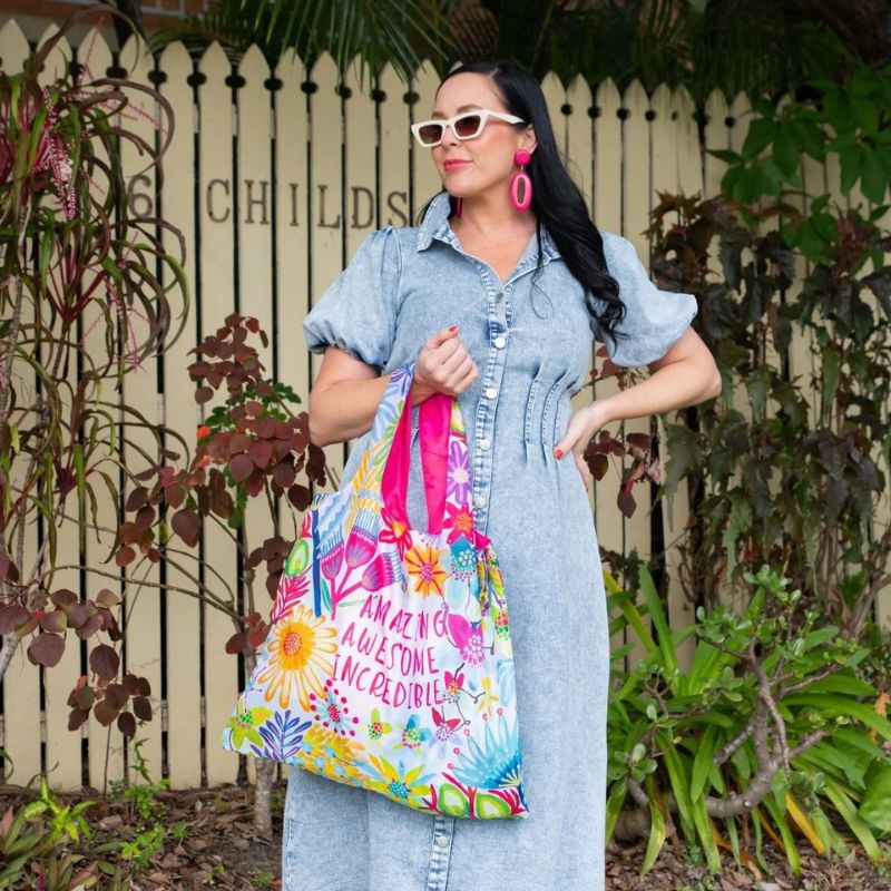 Ruby Olive reusable shopping bag made from recycled plastic bottles - woman holding a bag.