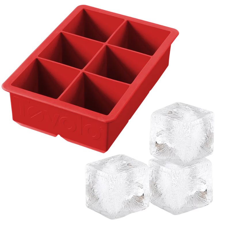 Tovolo King Cube Ice Tray 2" Cubes in Apple Red - with ice cubes next to it. 