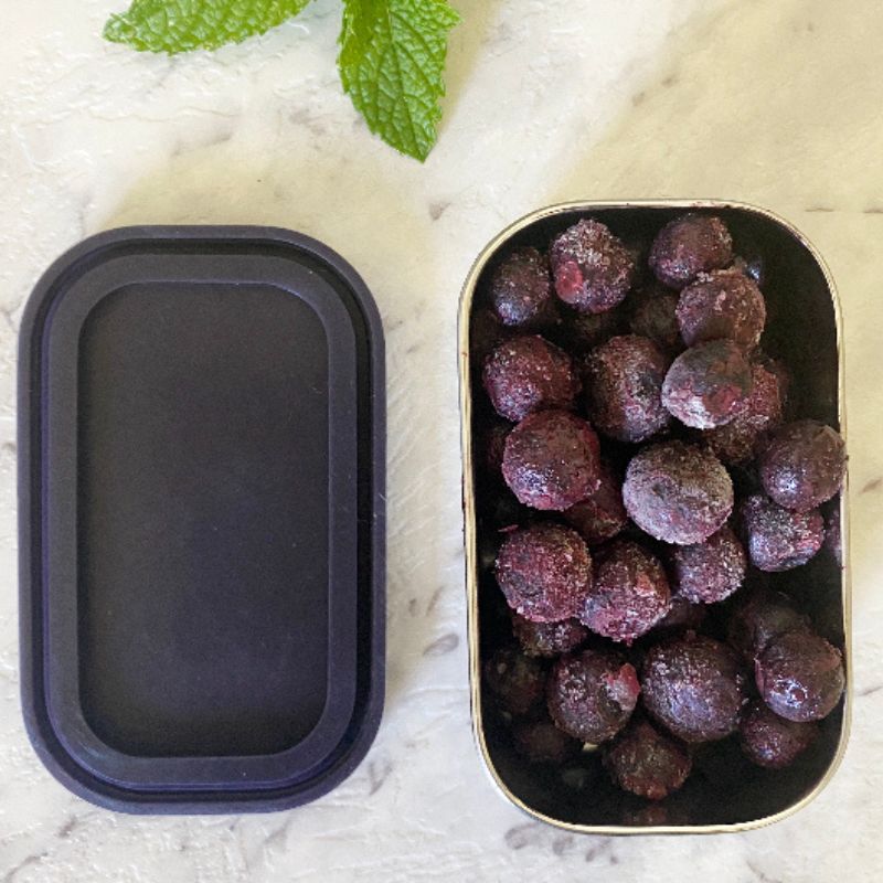 Green Essentials Tiny Tin Stainless Steel container with silicone lid - 150ml - open with berries in