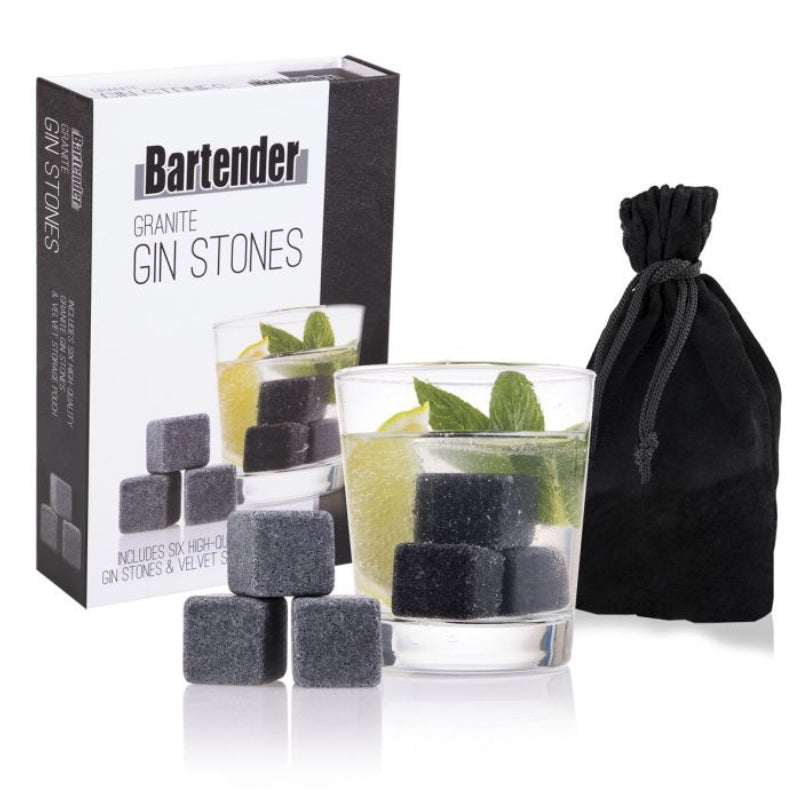 Bartender reusable freezable gin stones in a glass next to the gift box.granite stone - in a glass next to the gift box.