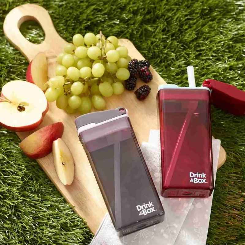 Drink in the box reusable juice popper box - 355ml  - mixed photo with boxes on a platter with grapes.