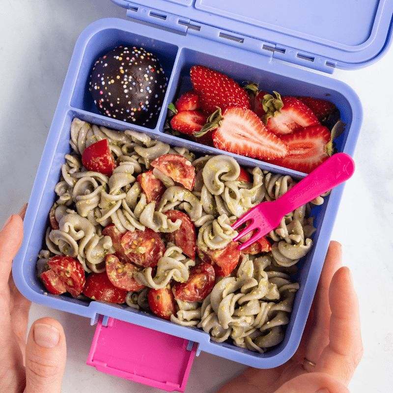 Little Lunch Box Co Three - open with pasta and strawberries.