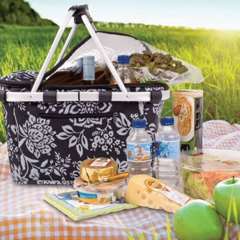 Sachi insulated carry picnic basket with lid - shown with food on a picnic rug.