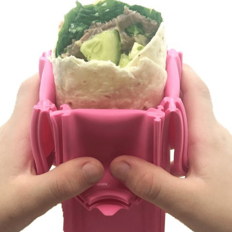 Wrap'd silicone wrap holder in pink - open with food.