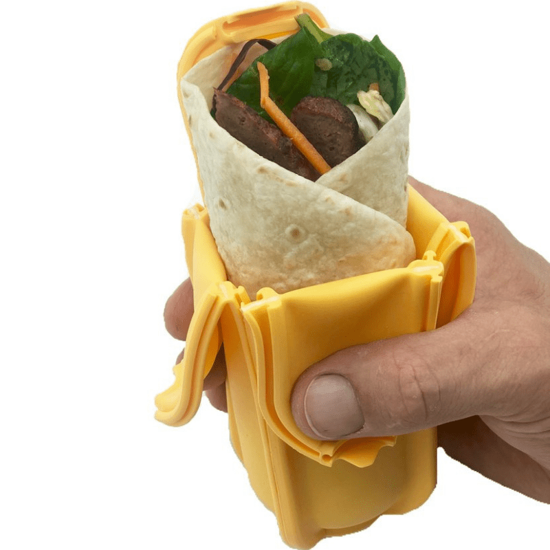 Wrap'd silicone wrap holder in yellow - open with food.