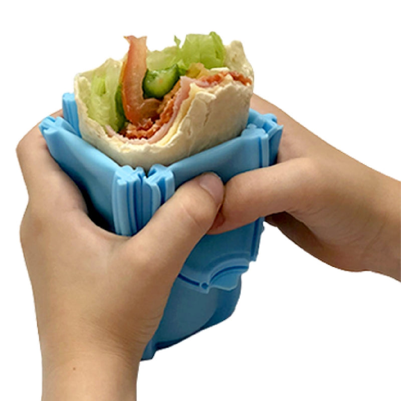 Wrap'd silicone wrap holder in blue - open with food.